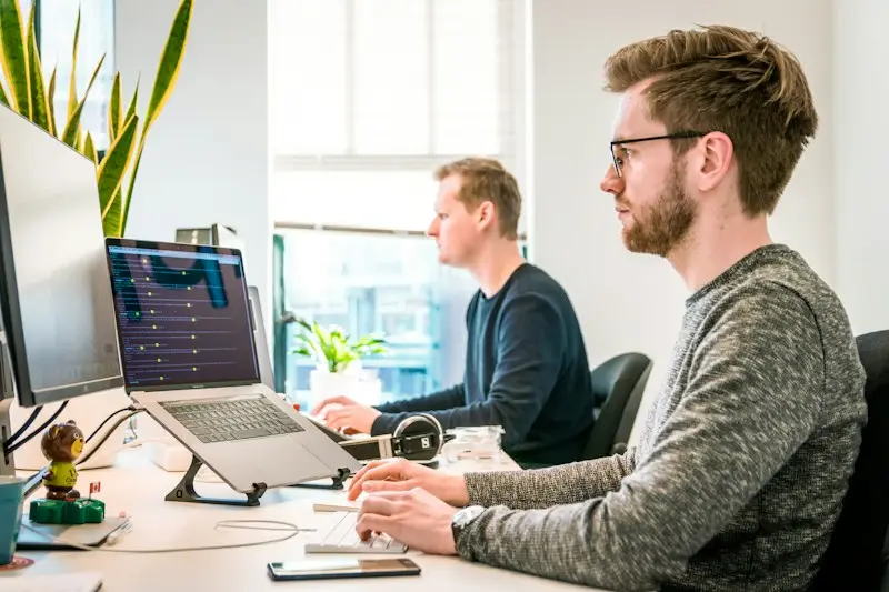 Developers at their desks working on a project